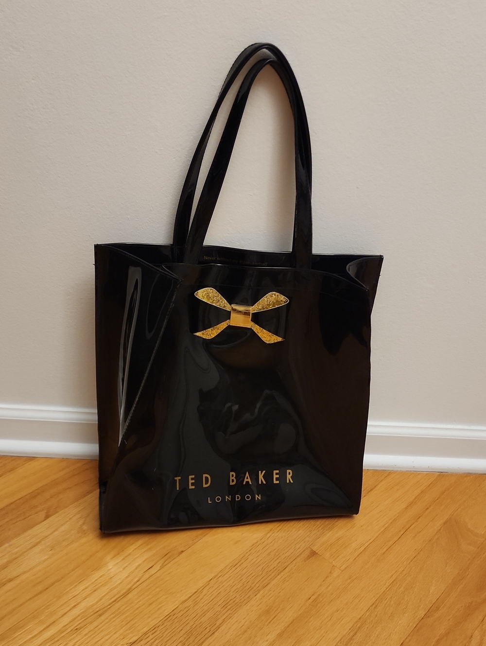 Ted Baker Glossy Black Tote with Gold Bow Accent